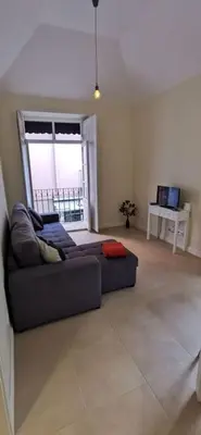 a living room with a couch and a table with a laptop at Franciscus 1a in Funchal