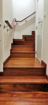 a staircase with wooden floors and a railing at Franciscus 2c in Funchal