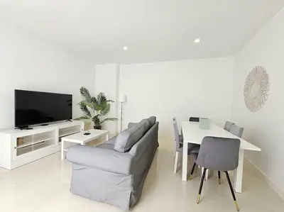 a living room with a couch and a table and a tv at Caminho da Achada Apartment Funchal by Rentallido in Funchal