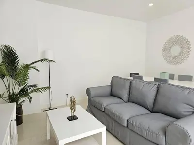 a living room with a couch and a table at Caminho da Achada Apartment Funchal by Rentallido in Funchal