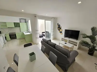 a living room with a couch and a table at Caminho da Achada Apartment Funchal by Rentallido in Funchal