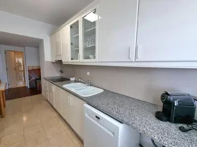 a kitchen with a sink and a counter top at Infante Sunset Funchal by Rentallido in Funchal