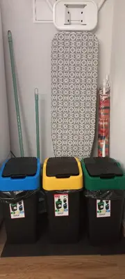 three trash cans in a room with a bed at Levadinha - Nature guest house in Madalena do Mar