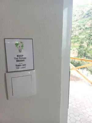 a sign on a wall next to a window at Levadinha - Nature guest house in Madalena do Mar