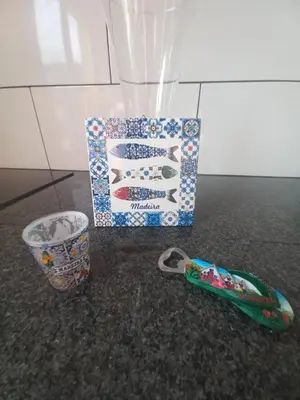 a box and a pair of scissors and a cup at Levadinha - Nature guest house in Madalena do Mar