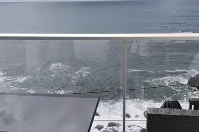 a view of the ocean from a room with a window at Apt 'A Gaioa' in 'The Cliff Coast Accomodation' in Paul do Mar