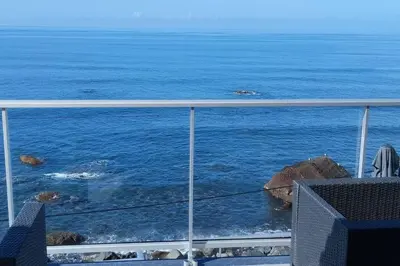 a view of the ocean from a balcony at Apt 'A Gaioa' in 'The Cliff Coast Accomodation' in Paul do Mar