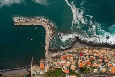 an aerial view of a beach and the ocean at Apt 'A Gaioa' in 'The Cliff Coast Accomodation' in Paul do Mar