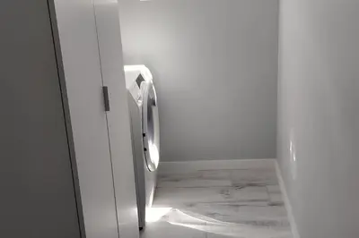a white refrigerator with a door open in a room at Apt 'A Gaioa' in 'The Cliff Coast Accomodation' in Paul do Mar