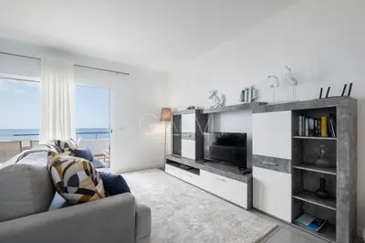 a living room with a couch and a television at Esterinha's Ocean Apartment by GALMI in Jardim do Mar