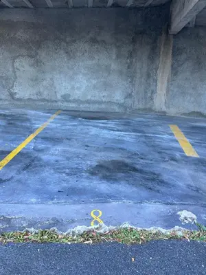 a pair of scissors sitting in a parking lot at SÃO GONÇALO APARTAMENTO in Funchal