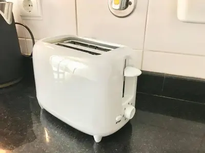 a white toaster sitting on the wall of a bathroom at Gemini Apartment by AM in Funchal