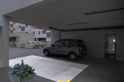 a small car parked in a parking lot at Casa da Clara by MTH in Caniço