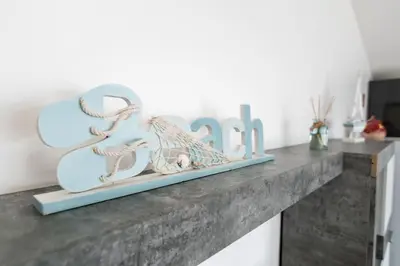 a shelf with a blue sign that says at Esterinha's Sunset Apartment by GALMI in Estreito da Calheta