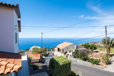 a view of the ocean from a house at Villa Pequenino by GALMI in Estreito da Calheta