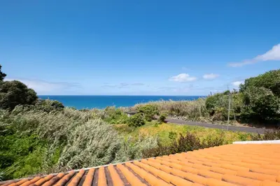 a view of the ocean from the roof of a house at Casa del Mar II by GALMI in Arco de São Jorge