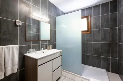 a bathroom with a sink and a shower at Casa del Mar II by GALMI in Arco de São Jorge