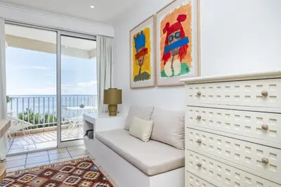 a living room with a couch and a view of the ocean at Studio Mar - By WeHost in Funchal