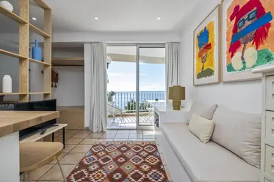 a living room with a couch and a table at Studio Mar - By WeHost in Funchal