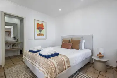 a bedroom with a bed with towels on it at Studio Mar - By WeHost in Funchal