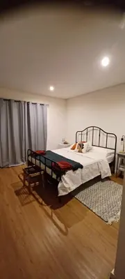 a bedroom with a bed and a rug at Quinta Sol II Sea in Camacha