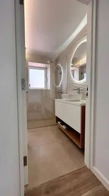 a bathroom with a sink and a mirror at Casa Branca Apartment in Funchal in Funchal