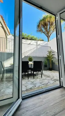 a view of a patio through a sliding glass door at Casa Branca Apartment in Funchal in Funchal