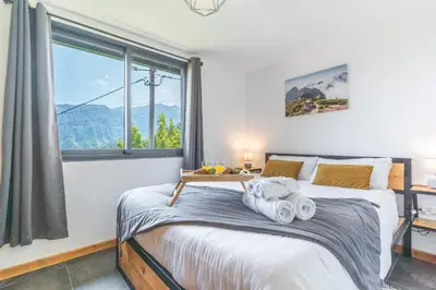 a bedroom with a bed with towels on it at Mystic Mountain by Atlantic Holiday in São Vicente