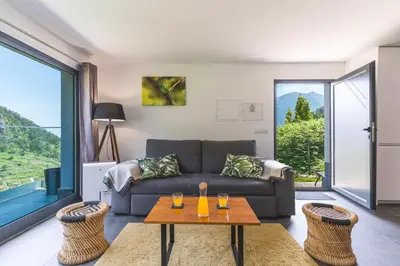 a living room with a couch and a table at Mystic Mountain by Atlantic Holiday in São Vicente