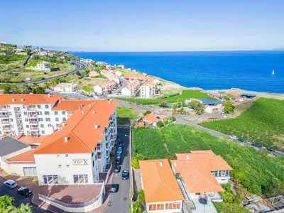 an aerial view of a city with the ocean at Hideaway Apartment by Homie in Caniço