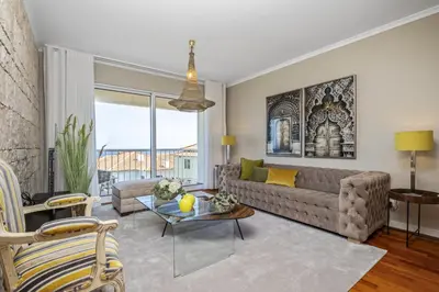 a living room with a couch and a table at Hideaway Apartment by Homie in Caniço