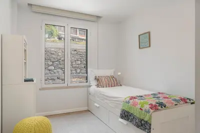 a bedroom with a bed and a window at Vista Formosa I by An Island Apart in Funchal