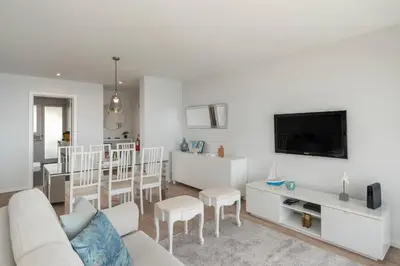 a living room with a couch and a tv at Vista Formosa I by An Island Apart in Funchal
