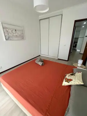 a room with a large red blanket on the floor at Santa Catarina by Olá Madeira in Funchal