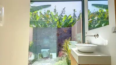 a bathroom with a sink and a large window at Serenity Valley Escape by LovelyStay in Ribeira Brava