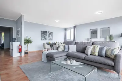 a living room with a couch and a table at Barreiros Serenity by Homie in Funchal