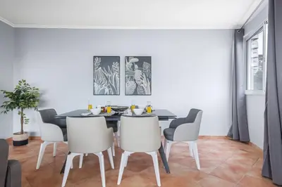 a dining room with a table and chairs at Barreiros Serenity by Homie in Funchal