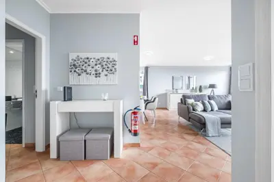 a living room with a couch and a table at Barreiros Serenity by Homie in Funchal
