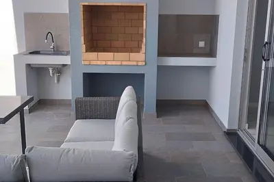 a living room with a couch and a sink at Apt. 'A Bicuda' by The Cliff Coast Accomodation in Paul do Mar