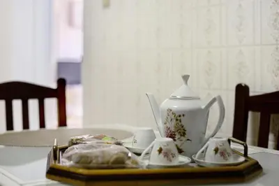 a tea set on a table with a tea pot at Casa do tio Inácio in Santana