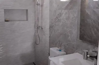a bathroom with a shower and a toilet and a sink at 'A Bucha' by The Cliff Coast in Paul do Mar