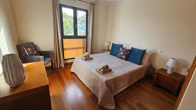 a bedroom with a bed with two towels on it at Serenity Apartment - Free Parking in Santa Cruz