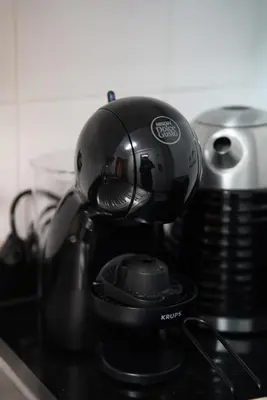 a coffee pot sitting on a counter next to a camera at Serenity Apartment - Free Parking in Santa Cruz