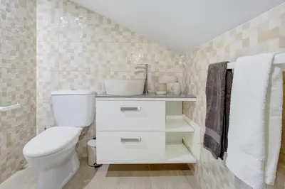 a bathroom with a toilet and a sink at Alegria Dream Home in Funchal