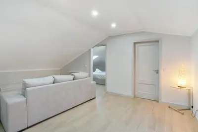 a white living room with a couch and a table at Alegria Dream Home in Funchal