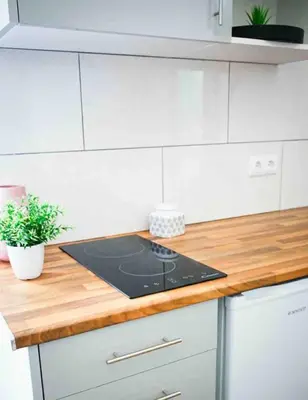 a kitchen with a counter top with a stove at Casa na Ilha I in Funchal