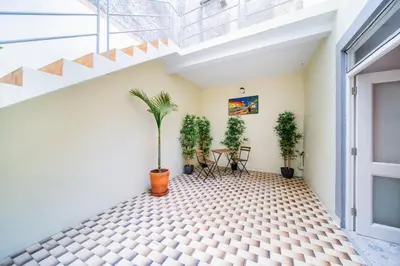 a room with a tiled floor with a plant at Casa na Ilha II in Funchal