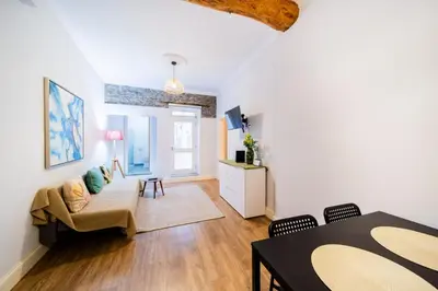a living room with a couch and a table at Casa na Ilha II in Funchal