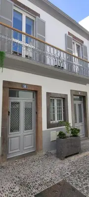 an apartment building with a door and a balcony at Casa na Ilha III in Funchal