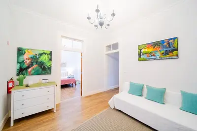 a living room with a white couch and a dresser at Casa na Ilha IV in Funchal